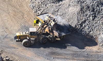 Front end loader and truck on mine which uses Bika Open Source LIMS